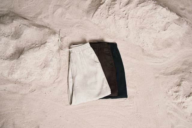 Model wearing relaxed organic linen shorts