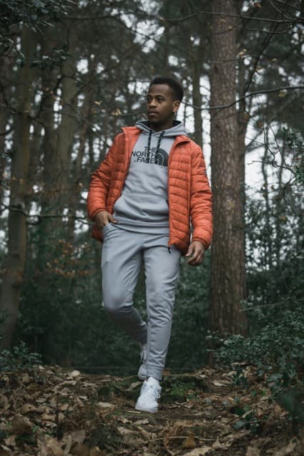 Person wearing a puffy recycled down vest